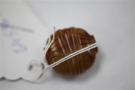 A Chinese yellow chalcedony bead, 19th century, 2.6cm